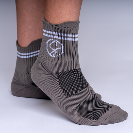 Gray socks with a logo on a white background