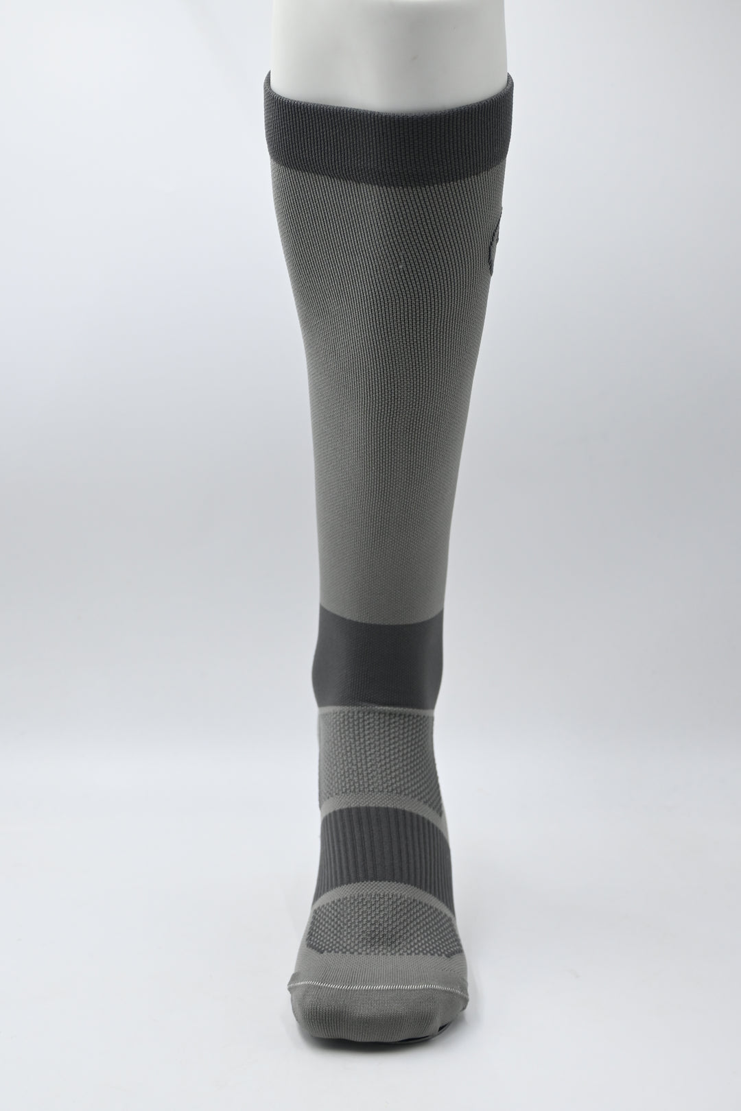 Gray compression sock on a white background