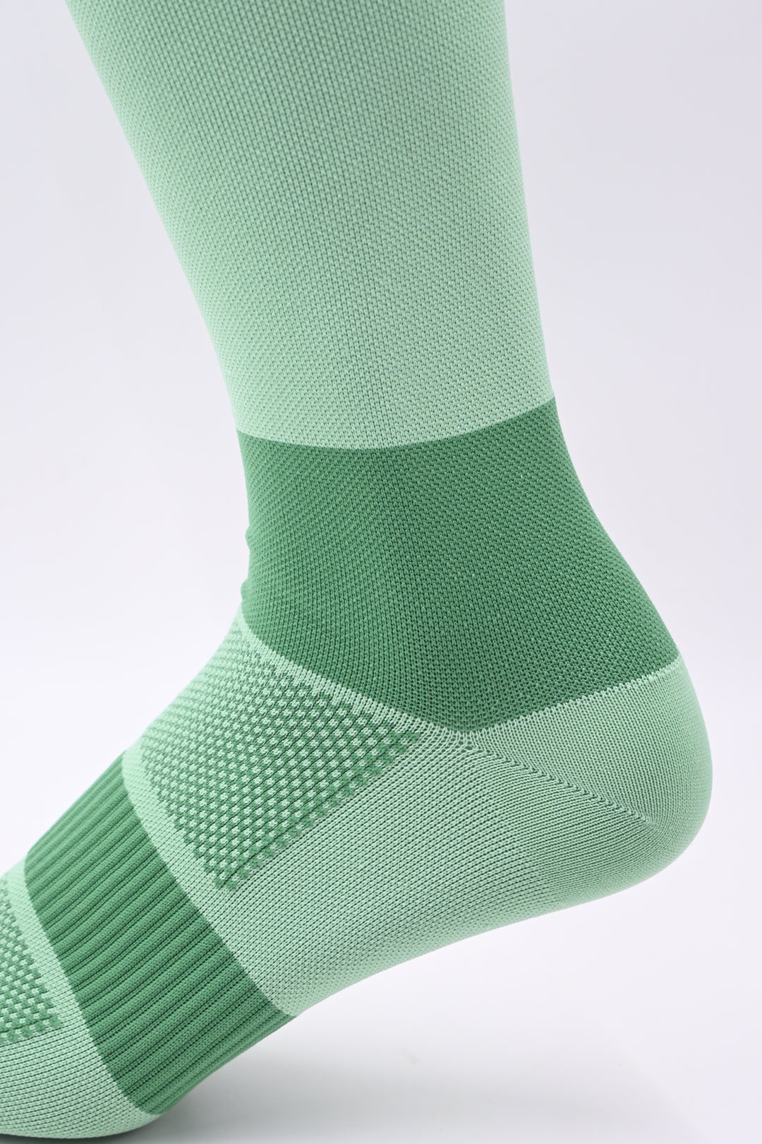 Green sock on a white background