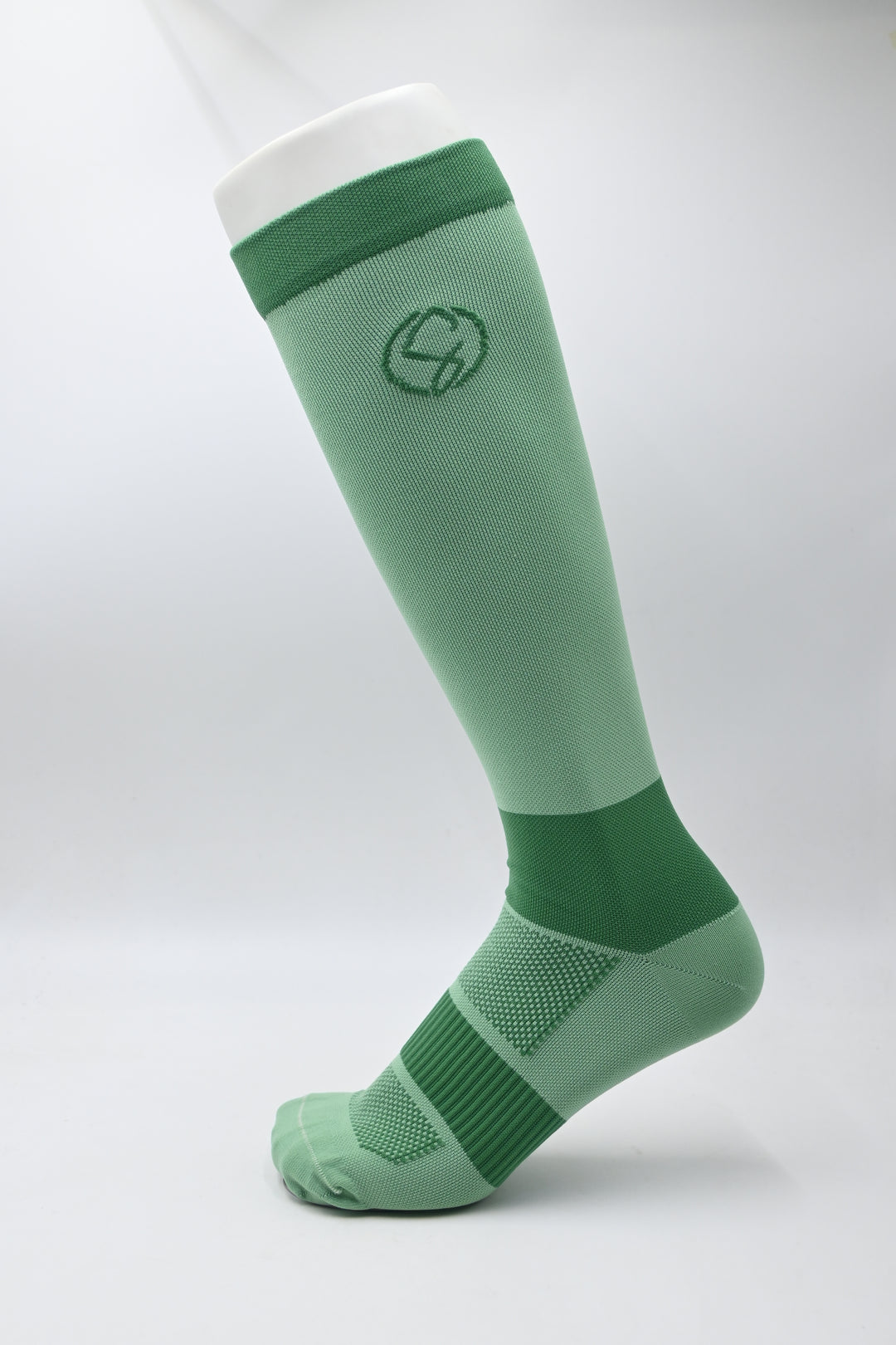 Green Knee High Compression Socks with a logo on a white background