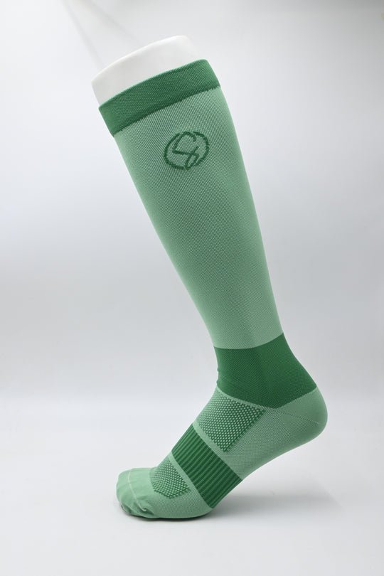 Green Knee High Compression Socks with a logo on a white background