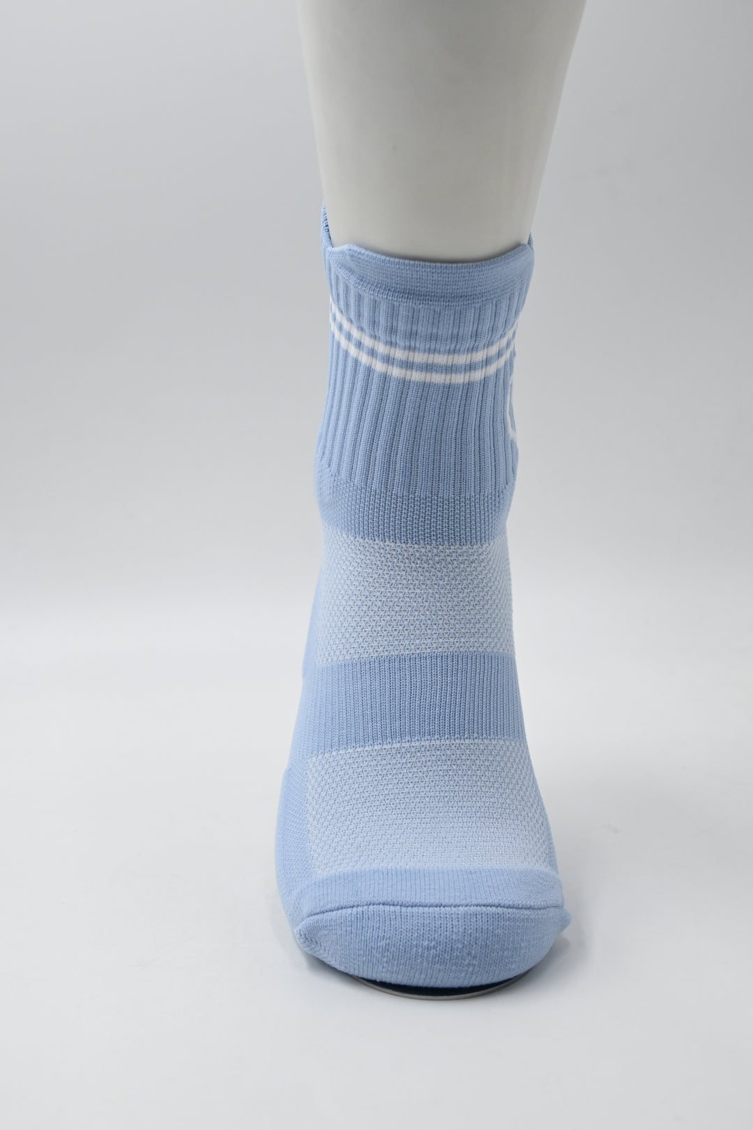 Blue striped sock on a white background